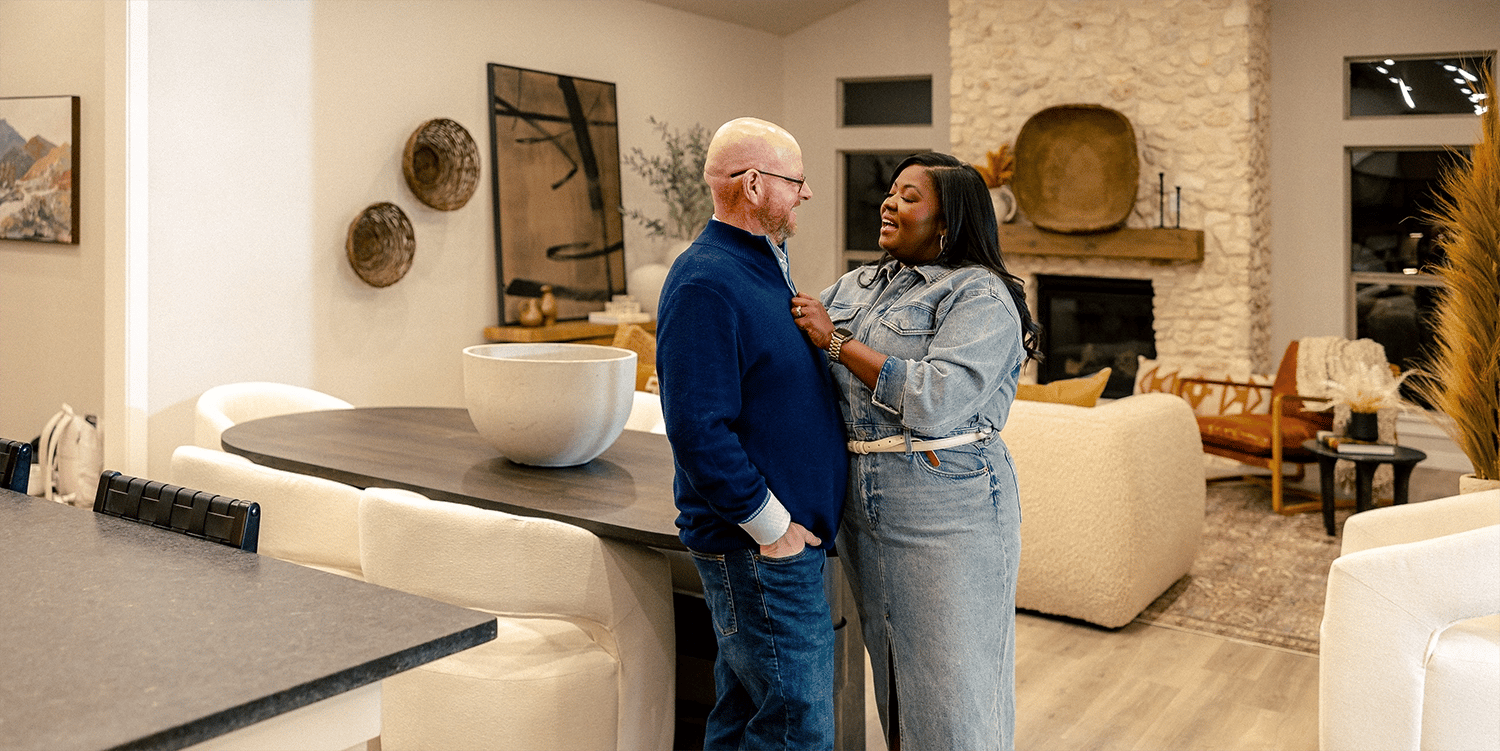 Happy Couple standing in their kitchen