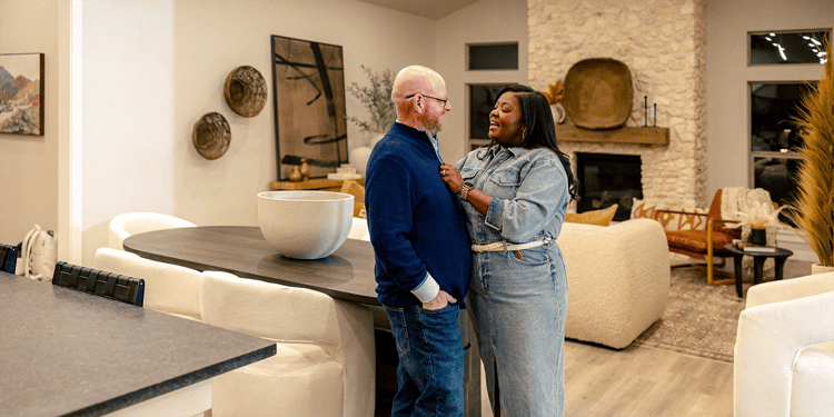 Happy Couple standing in their kitchen
